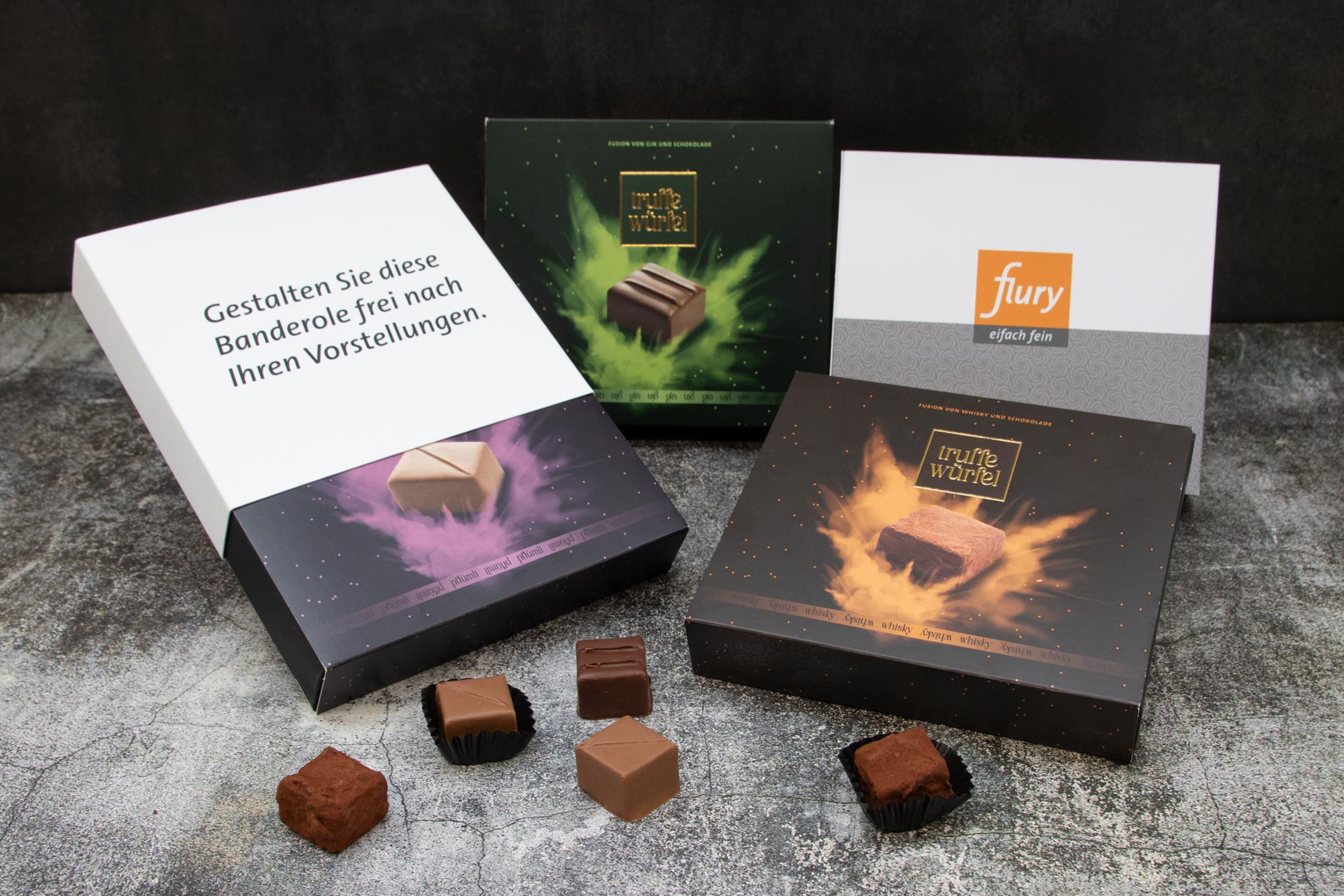 Logo_Truffe Würfel Verpackung.jpg Truffe Wüfel in den Editionen Pflümli, Gin und Whisky mit individuellen Banderolen