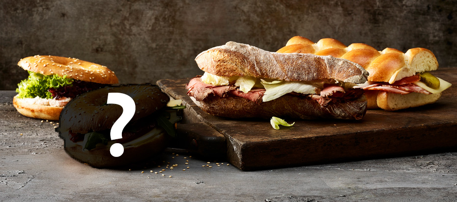 Verschiedene Sandwiches, eines davon ist nicht zu erkennen und mit einem Fragezeichen versehen.