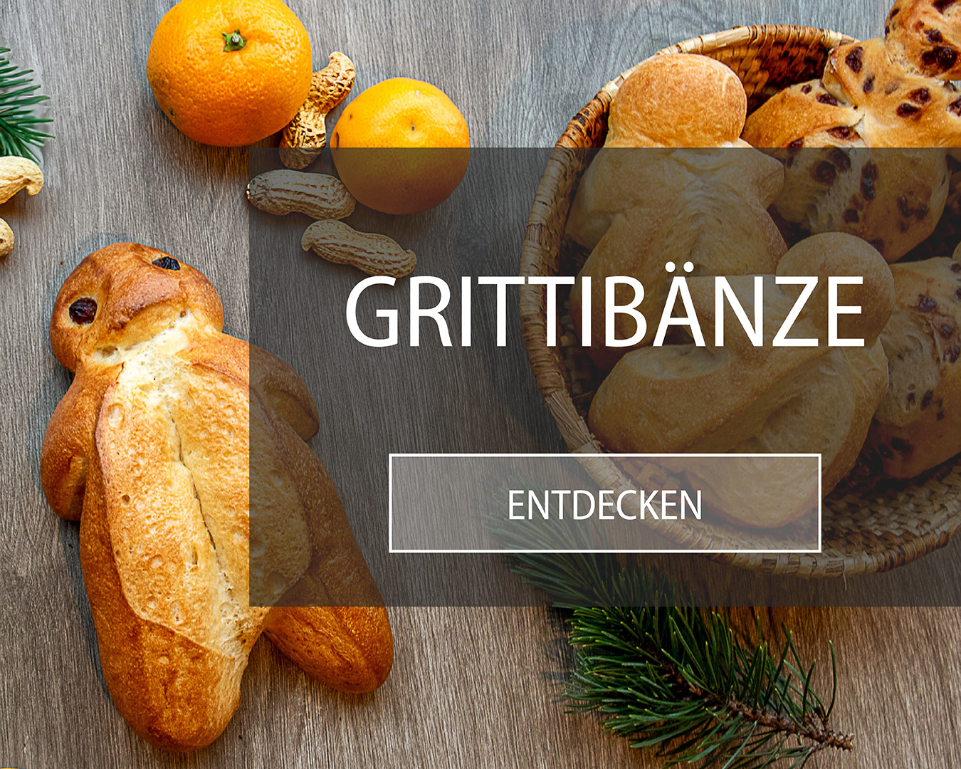 Grittibänzen mit Erdnüssli und Tannenzweig.