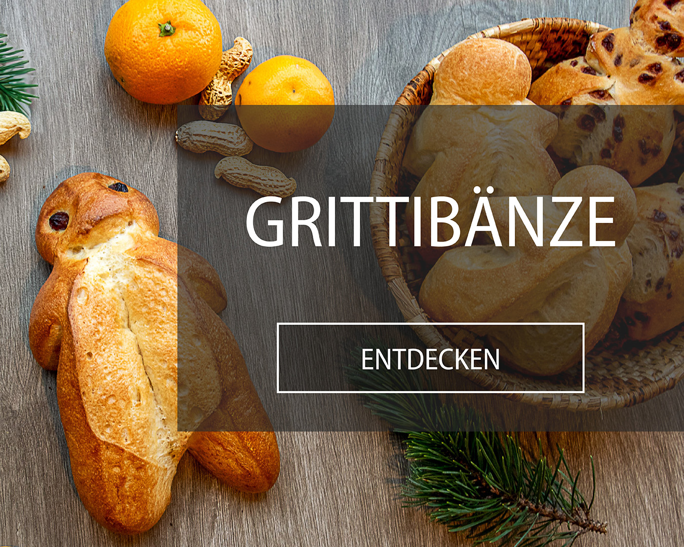 Grittibänzen mit Erdnüssli und Tannenzweig.